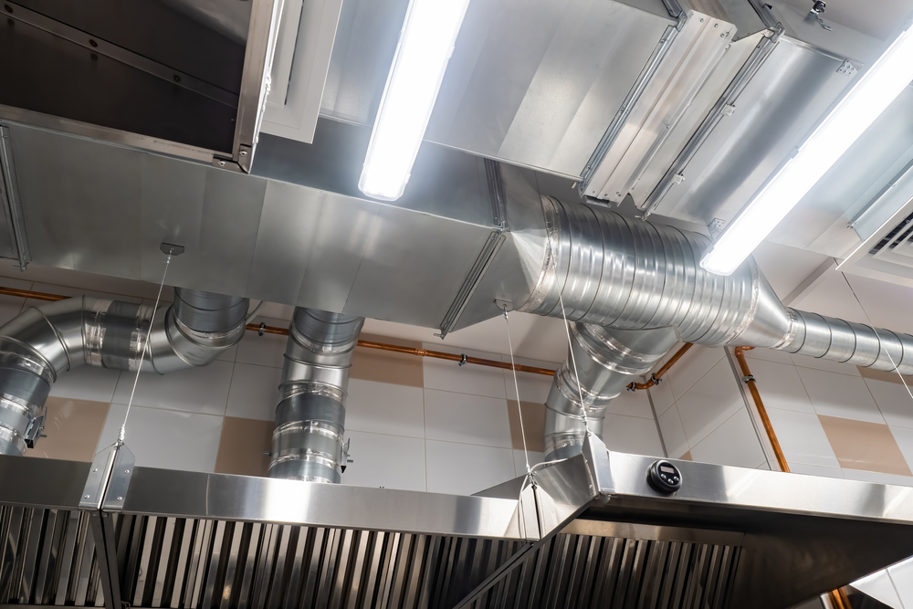 Ventilation Pipes In Silver Insulation Material in A Commercial Kitchen